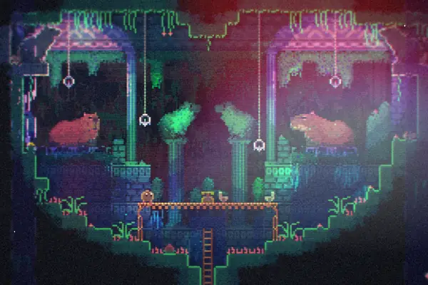 A dark pixel-art chamber in Animal Well, lit by glowing green lanterns, with two capybaras resting under the arches.