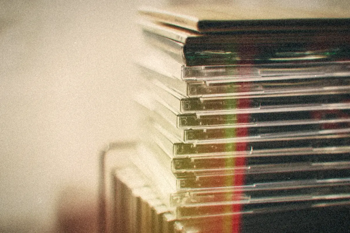 A tall stack of clear disc cases.