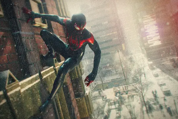Spider-Man in his black and red suit crouched on a brick wall above a snowy New York street.